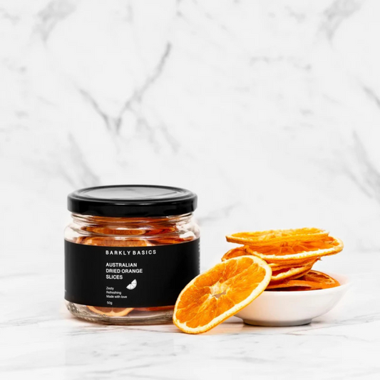 Jar of dried orange slices by Barkly Basics with a bowl of orange slices on a white background - available at LOVINLIFE Co Byron Bay for all your gifts, candles and interior decorating needs
