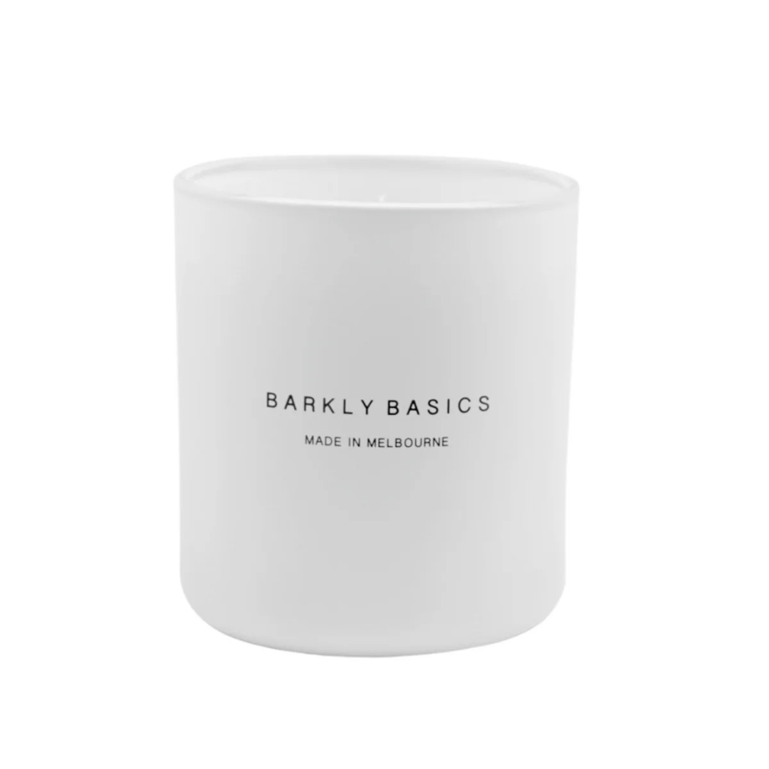 White candle with 'Barkly Basics' text on a white background. Scented with Lemongrass and Kaffir Lime. Available at LOVINLIFE Co Byron Bay for all your gifts, candles and interior decorating needs