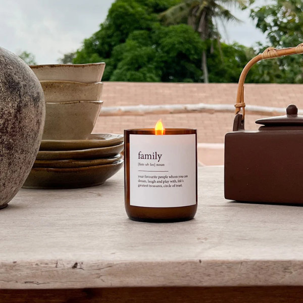 Candle labelled 'family' on a stone surface with natural background. These Dictionary Meaning Candles are one of our most loved products. We have spent an abundance of time, curating our own meanings of the words to help you feel connected, to help you tell someone how you feel in a unique way. Available at LOVINLIFE Co Byron Bay