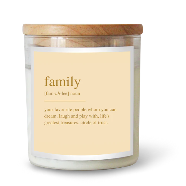 Candle with a wooden lid and a label defining 'family' on a white background. These Goldie Dictionary Candles are a little bit luxe, and will surely make your favourite folks feel super special. Featuring luxe gold foil on a matte textured label, these are a stand out. Available at LOVINLIFE Co Byron Bay