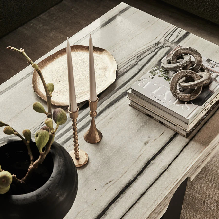 Enchant Brass Candle Stand holding a candle pictured from above on a coffee table - available at LOVINLIFE Co Byron Bay for all your gifts, candles and interior decorating needs
