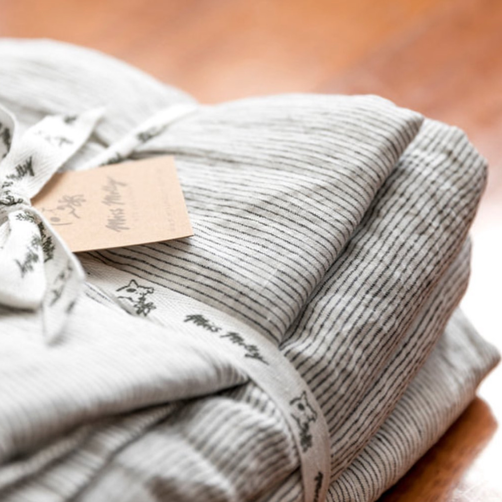 French flax linen sheets, prewashed and softened to sit gently against your skin – Pinstripe French linen bed sheets set pictured folded - available at LOVINLIFE Co Byron Bay for all your gifts, candles and interior decorating needs