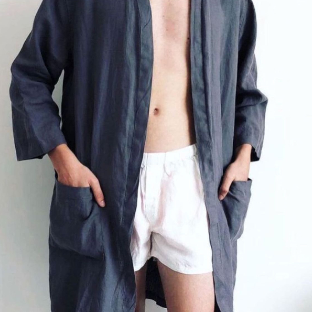 French flax linen unisex boxer shorts, loose, comfy and playful for men and women of all shapes and sizes - Available in 5 colours: White, Pinstripe, Natural, Navy & Charcoal – White boxer shorts pictured on a man in a navy linen robe - available at LOVINLIFE Co Byron Bay for all your gifts, candles and interior decorating needs