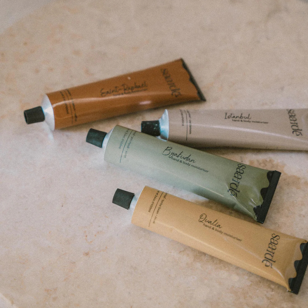 Hand & Body Moisturiser by Saarde - Saint-Raphael, Istanbul, Byakudan and Qualia pictured as a flat lay on a cream coloured bench - Stocked at LOVINLIFE Co Byron Bay for all your gifts, candles and interior decorating needs