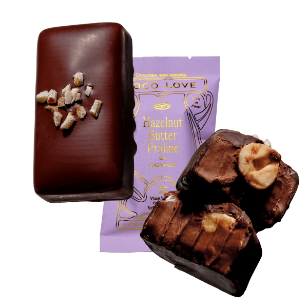 Images shows unwrapped and wrapped (purple) Loco Love Hazelnut Butter Praline Chocolates. Vegan, gluten-free, sustainably sourced and no refined sugars. 
Available LOVINLIFE Co Byron Bay.