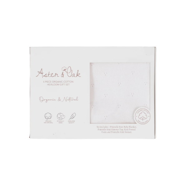 Aster & Oak organic cotton gift set packaging on a white background. The set is an 100% organic cotton 4-piece Heirloom Knit Baby Gift Set in white with top, pants, bonnet and blanket. Set by Aster & Oak and Stocked at LOVINLIFE Co Byron Bay for all your gifts, candles and interior decorating needs