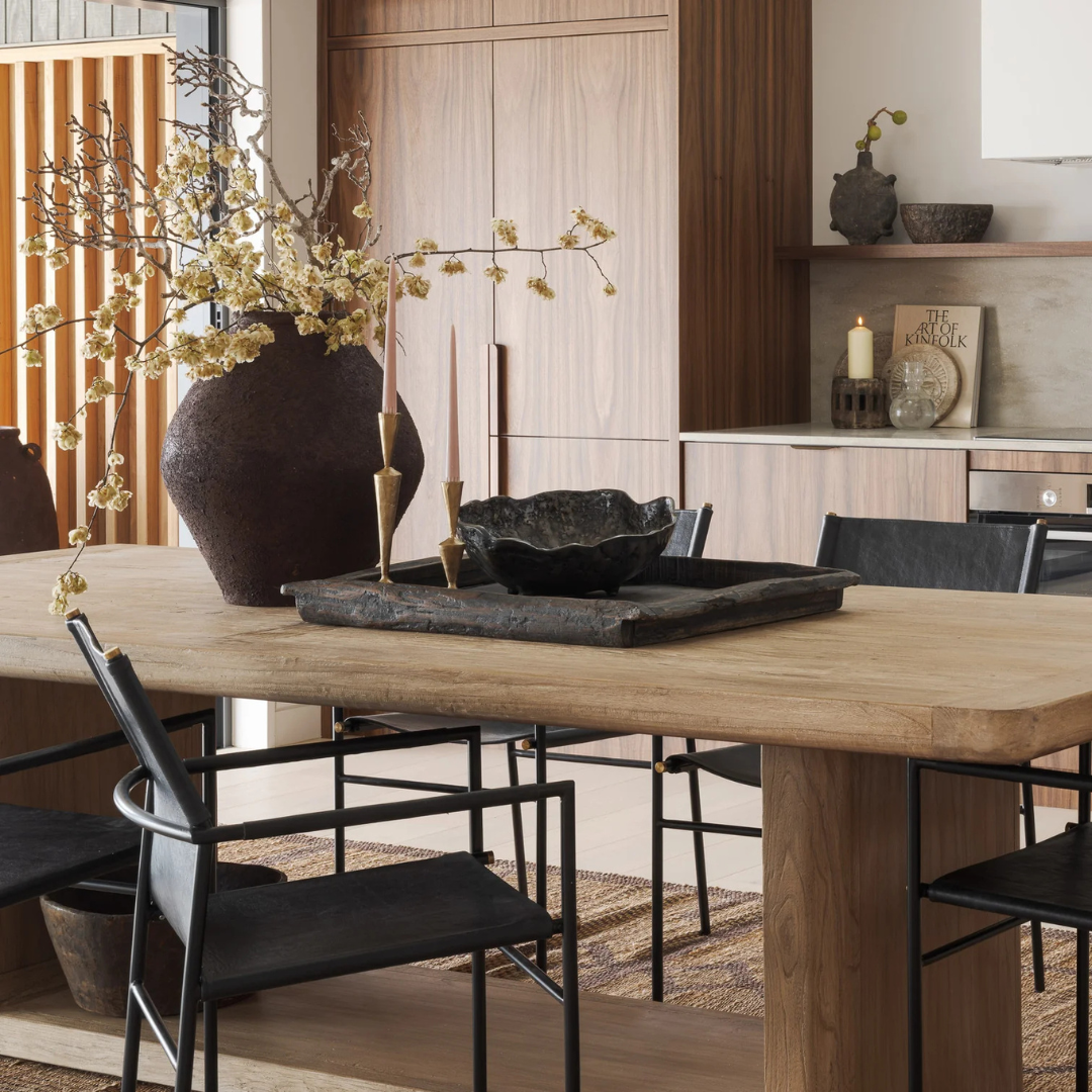 Iris Brass Candle Stands x 2 holding soft pink candles on a table next to a large pot holding fresh blossoms - available at LOVINLIFE Co Byron Bay for all your gifts, candles and interior decorating needs