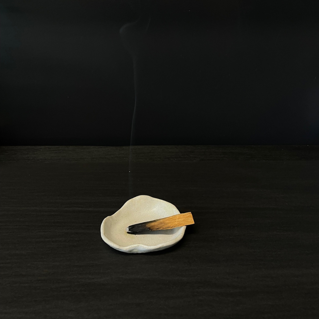Lovinlife Co ByronBay – handmade Ceramic Smudging Plate for your Smudge sticks or Palo Santo, soap or trinkets – pictured with smoking palo santo smudging stick - available at LOVINLIFE Co Byron Bay for all your gifts, candles and interior decorating needs