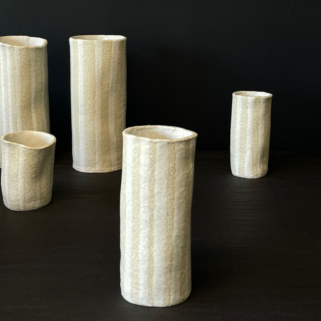Lovinlife Co ByronBay - Handmade Signature Ceramics Range - Natural white clay vases finished with a ‘milk gloss’ hand painted glaze detail - The Stripe Series, Ceramic Vase V5 - Medium Even Stripe pictured infront of all other sizes - available at LOVINLIFE Co Byron Bay for all your gifts, candles and interior decorating needs