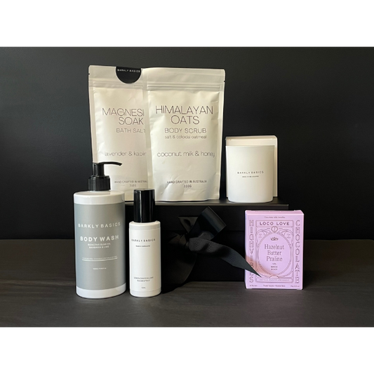 Pamper Deluxe Gift Box containing Body Wash, Magnesium Bath Soak, Bod Scrub, Room Spray, Candle and twin box of Loco Love Chocolates. Available at LOVINLIFE Co Byron Bay