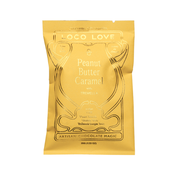 Butter Yellow packaging of Loco Love Peanut Butter Caramel Chocolate. Vegan, gluten-free, sustainably sourced and no refined sugars. 
Available LOVINLIFE Co Byron Bay.