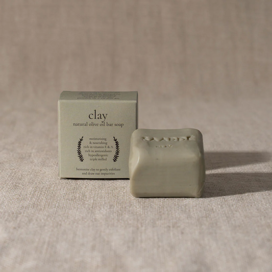 Lovinlife Co ByronBay – Saarde Clay Olive Oil Bar Soap – draws out impurities from blocked pores, beneficial for acne prone or oily skin - unscented – soap bar pictured on bench next to box - available at LOVINLIFE Co Byron Bay for all your gifts, candles and interior decorating needs