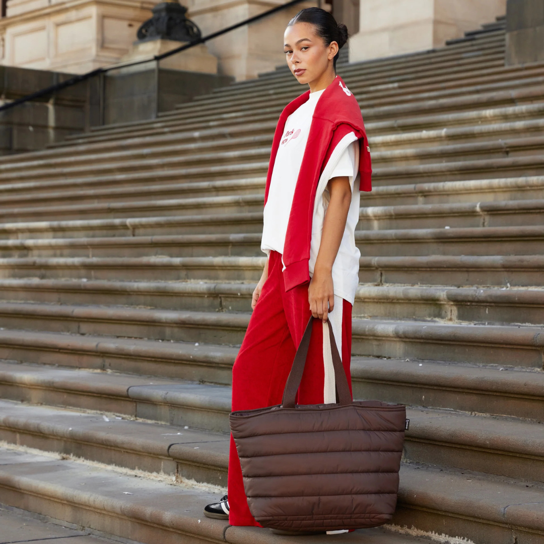 Take it Base Bag - A large soft-as-a-cloud shoulder bag for days on the go or weekends away - Chocolate bag pictured being carried by the handles - Stocked at LOVINLIFE Co Byron Bay for all your gifts, candles and interior decorating needs