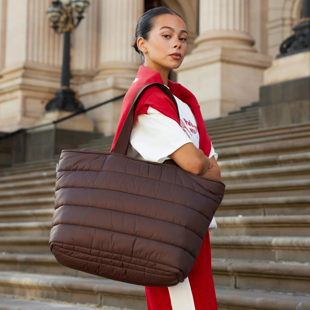Take it Base Bag - A large soft-as-a-cloud shoulder bag for days on the go or weekends away - Chocolate bag pictured being worn on the shoulder - Stocked at LOVINLIFE Co Byron Bay for all your gifts, candles and interior decorating needs