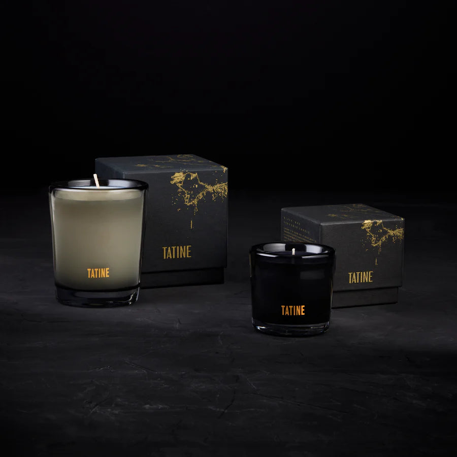 Tatine candles and boxes on a dark background. Wax Candles in Smoke Grey and black Mouth Blown Glassware, pictured with boxes - Stocked at LOVINLIFE Co Byron Bay, Australia for all your gifts, candles and interior decorating needs