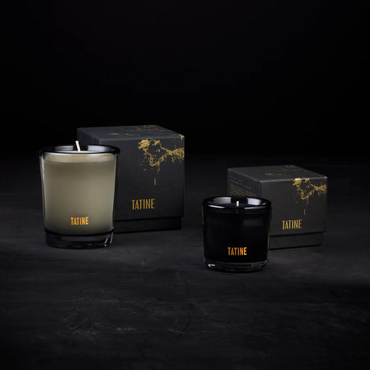 Tatine candles and boxes on a dark background. Wax Candles in Smoke Grey and black Mouth Blown Glassware, pictured with boxes - Stocked at LOVINLIFE Co Byron Bay, Australia for all your gifts, candles and interior decorating needs