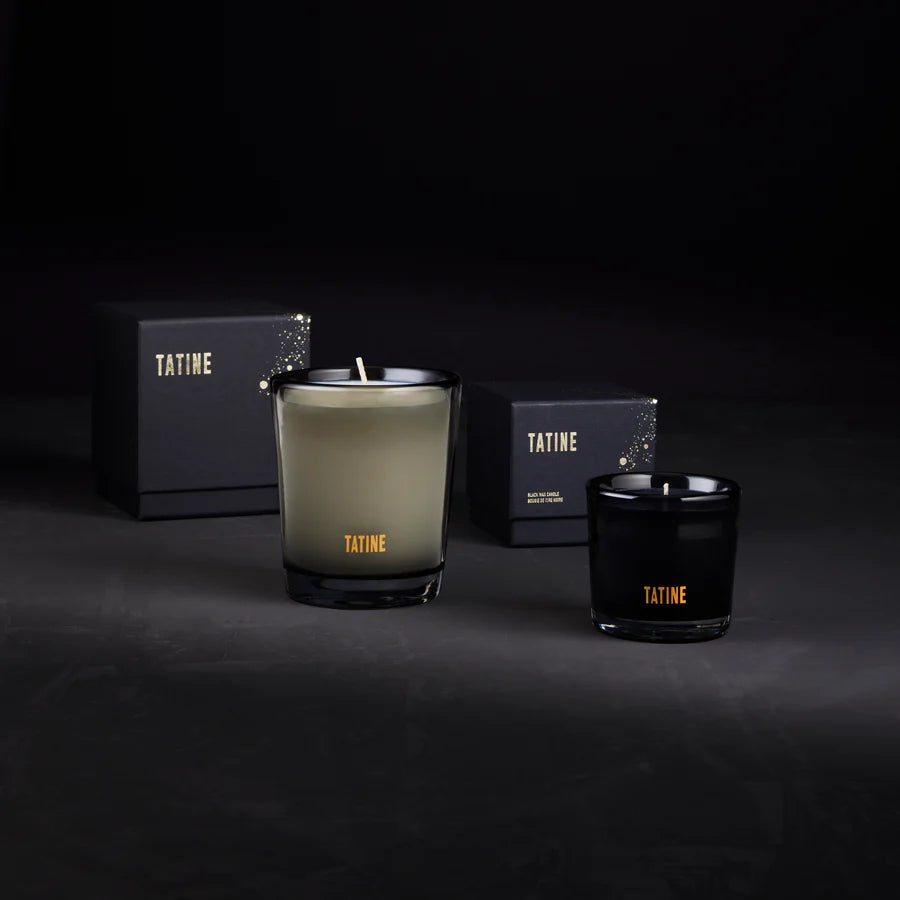 Two Tatine candles on a dark background with packaging. Stocked at LOVINLIFE Co Byron Bay for all your gifts, candles and interior decorating needs