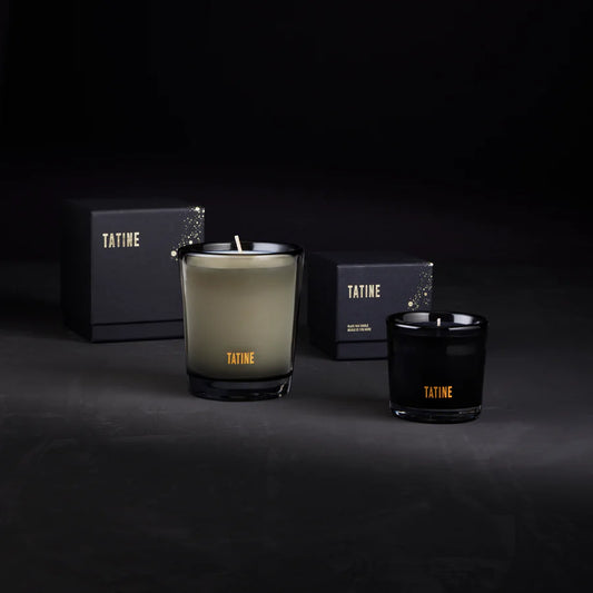 Two Tatine candles on a dark background with packaging. Stocked at LOVINLIFE Co Byron Bay for all your gifts, candles and interior decorating needs