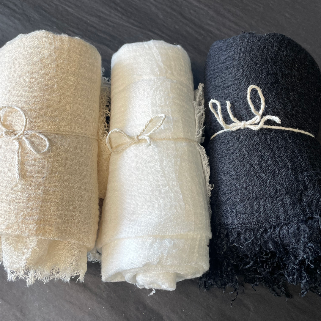 The Breeze Sarong – a soft, lightweight cotton sarong in black, white and sand – All pictured rolled up - Stocked at LOVINLIFE Co Byron Bay for all your gifts, candles, homewares and interior decorating needs