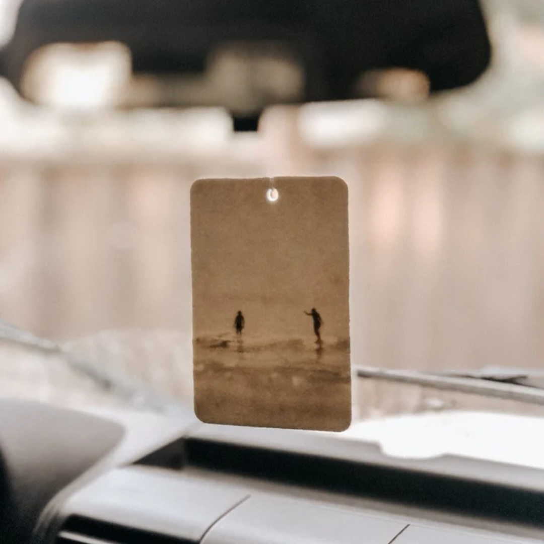 Summer design Air Freshener tags - Made from 100% post-consumer materials - Mali scent Blends coconut and lime sublime, take me for cocktails on the beach, with a summer breeze and palm trees - Party Wave tag pictured hanging on a rear-view mirror - Stocked at LOVINLIFE Co Byron Bay for all your gifts, candles and interior decorating needs