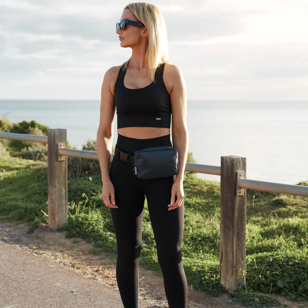 Waist Base Nylon Bag to wear on the waist like a fanny pack or bum bag, or slung over a shoulder - black bag pictured being worn on waist - Stocked at LOVINLIFE Co Byron Bay for all your gifts, candles and interior decorating needs