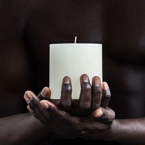 Candle Kiosk - All Natural Textured Pillar Candle - warm white, small, unscented being held in dark skin persons hands - Stocked at LOVINLIFE Co Byron Bay for all your gifts, candles and interior decorating needs