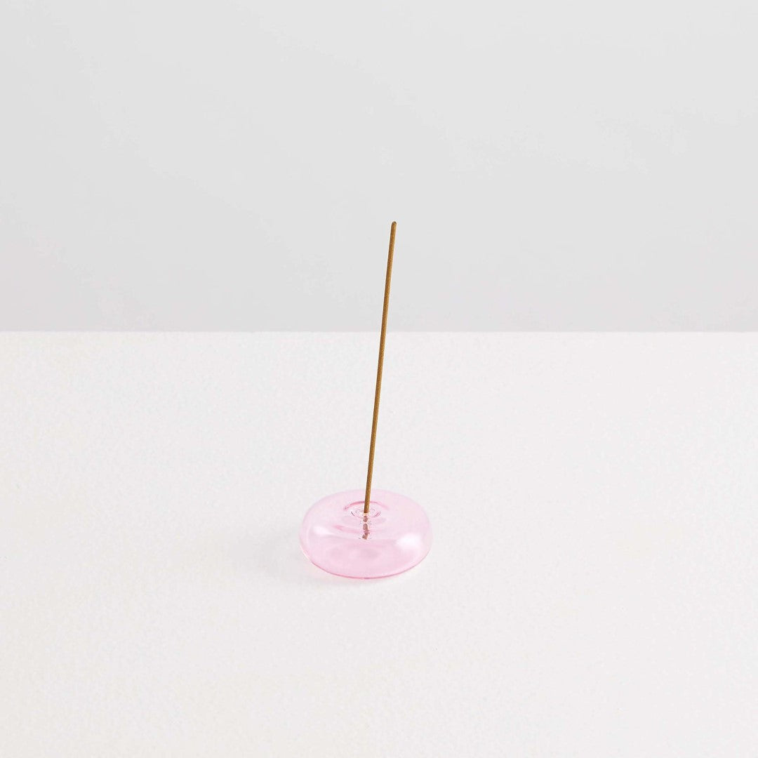 Maison Balzac Le Galet, or the pebble, is a playful and minimal bubble of 100% Borosilicate glass hand blown into a modern incense stick holder - pink glass pebbles with incense stick - Stocked at LOVINLIFE Co Byron Bay for all your gifts, candles and interior decorating needs