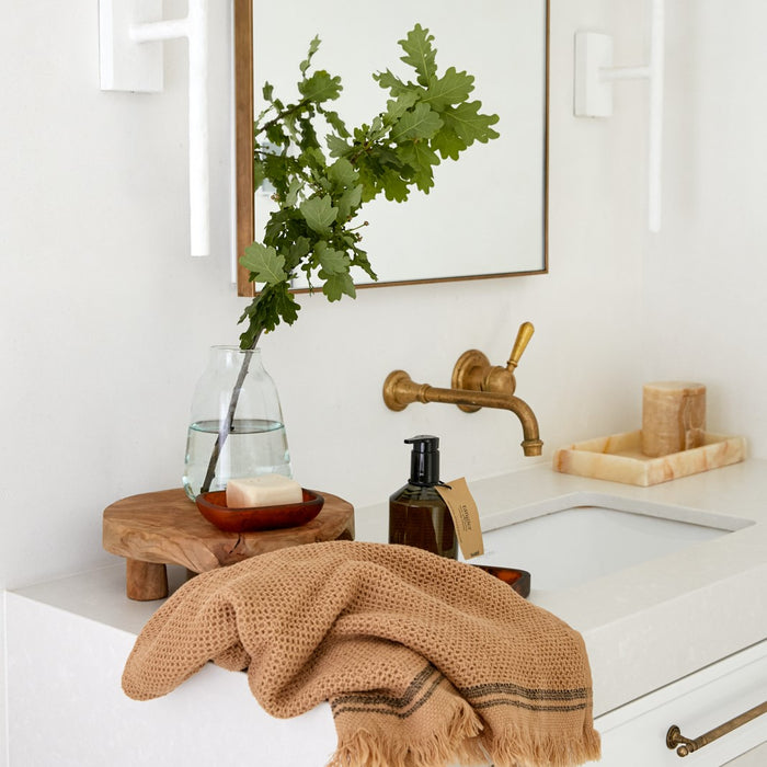 Lovinlife Co ByronBay – Saarde Istanbul Olive Oil Bar Soap – Clove, Sandalwood & Cardamom scent - pictured in red resin soap dish on bathroom sink setting - available at LOVINLIFE Co Byron Bay for all your gifts, candles and interior decorating needs