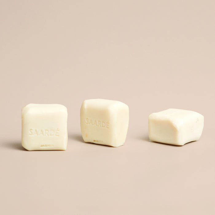 Lovinlife Co ByronBay – Saarde Jasmine Olive Oil Bar Soap – Jasmine Perfume – multiple soap bars pictured lying on bench - available at LOVINLIFE Co Byron Bay for all your gifts, candles and interior decorating needs