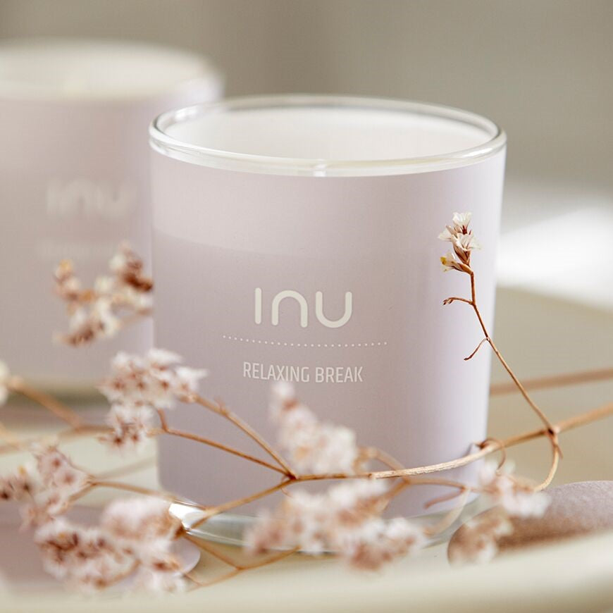 INU Relaxing Break Candle - Relaxing Break: Rose, Linden, Sandalwood - soy wax candle with organic cotton wicks and organic essential oils in pink glass jar amongst flowers - Stocked at LOVINLIFE Co Byron Bay for all your gifts, candles and interior decorating needs