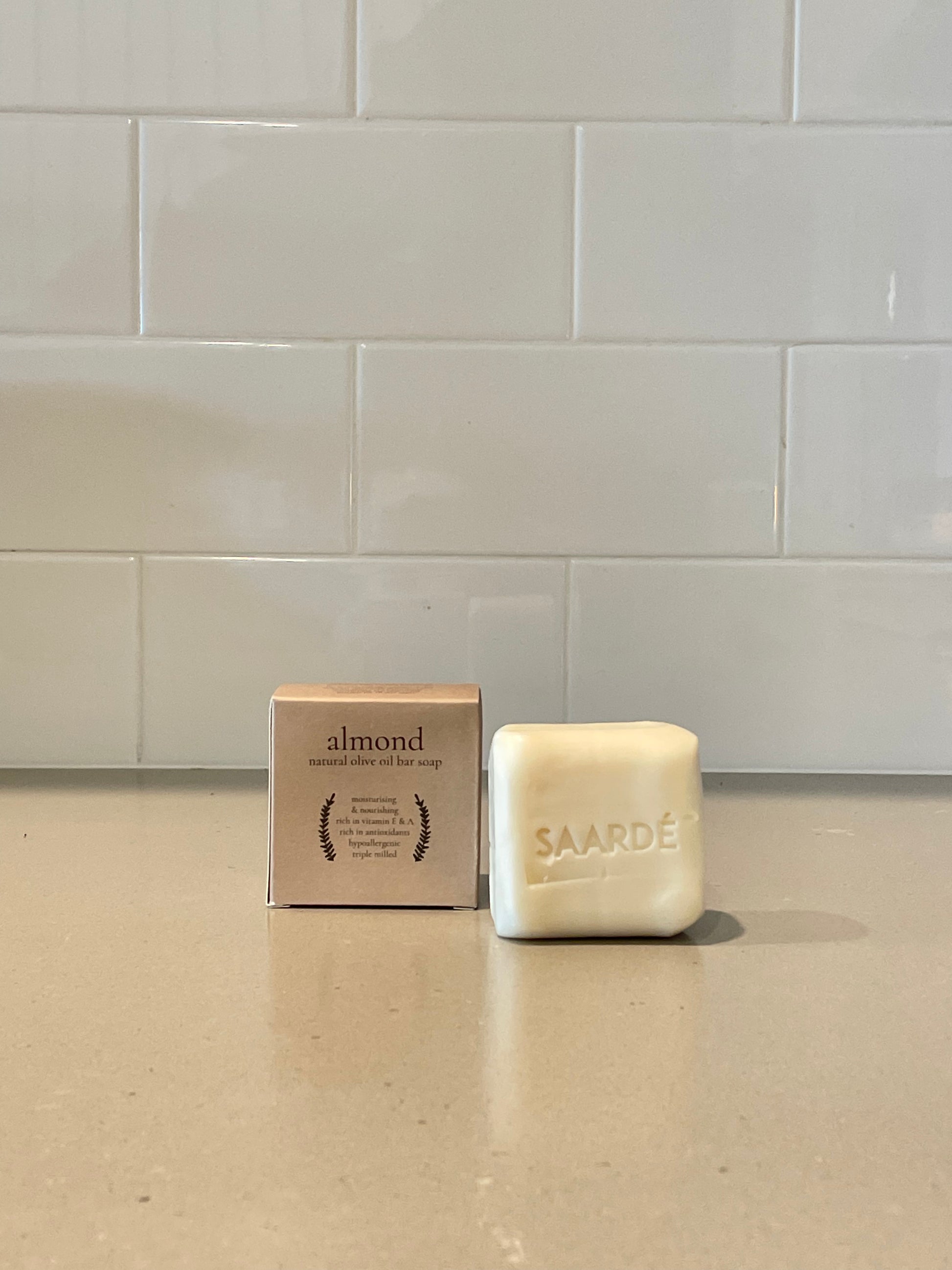 Lovinlife Co ByronBay – Saarde Almond Olive Oil Bar Soap – Almond Extract Perfume –pictured on stone bench with box - available at LOVINLIFE Co Byron Bay for all your gifts, candles and interior decorating needs