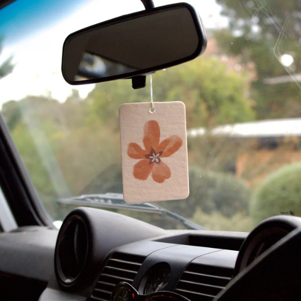 Flower Town design Air Freshener tags - Made from 100% post-consumer materials - BIARRITZ SCENT: jasmine, saffron + musk, Feel allured as you indulge in this poetic union that is luxe and luminous, yet grounding - Pictured hanging from rear vision mirror. Stocked at LOVINLIFE Co Byron Bay for all your gifts, candles and interior decorating needs