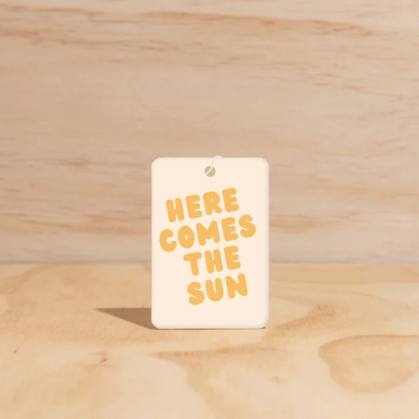 Here Comes The Sun design Air Freshener tags - Made from 100% post-consumer materials - BIARRITZ SCENT: jasmine, saffron + musk, Feel allured as you indulge in this poetic union that is luxe and luminous, yet grounding. Stocked at LOVINLIFE Co Byron Bay for all your gifts, candles and interior decorating needs