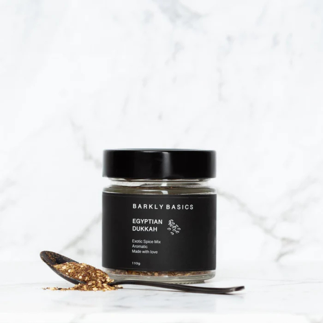 Jar of Barkly Basics Egyptian Dukkah spice mix with a spoonful of dukkah on a white background - available at LOVINLIFE Co Byron Bay for all your gifts, candles and interior decorating needs
