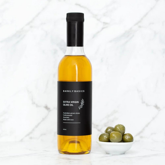 Barkly Basics Gourmet Extra Virgin Olive Oil - sourced from South Australian grown olives - Cold pressed - bottle pictured next to bowl of olives - available at LOVINLIFE Co Byron Bay for all your gifts, candles and interior decorating needs