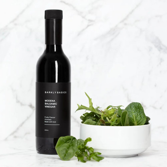 Barkly Basics Gourmet Modena Balsamic Vinegar - Sourced from Modena Italy - bottle pictured next to bowl of salad leaves - available at LOVINLIFE Co Byron Bay for all your gifts, candles and interior decorating needs