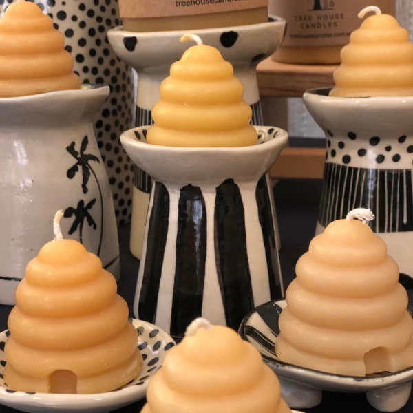Beehive-shaped candles made with pure beeswax and cotton wicks on decorative ceramic stands. Stocked at LOVINLIFE Co Byron Bay for all your gifts, candles and interior decorating needs