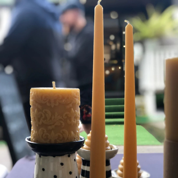 Decorative pure beeswax candles on a table with a blurred background. Stocked at LOVINLIFE Co Byron Bay for all your gifts, candles and interior decorating needs