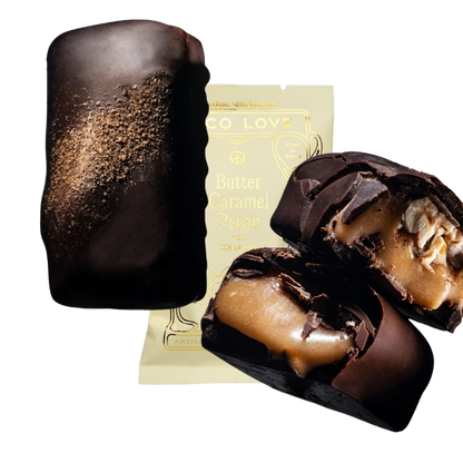 Images shows unwrapped and wrapped (purple) Loco Love Butter Caramel Pecan Chocolates. Vegan, gluten-free, sustainably sourced and no refined sugars. 
Available LOVINLIFE Co Byron Bay.