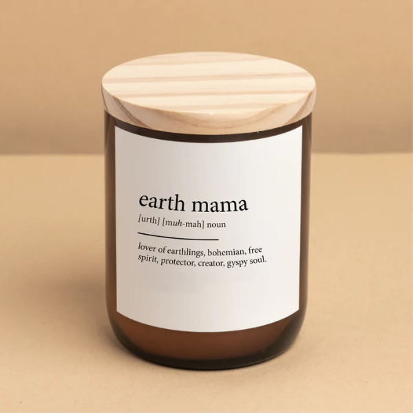 Candle with a wooden lid and label on a beige background. Labelled "earth mama". These Dictionary Meaning Candles are one of our most loved products. We have spent an abundance of time, curating our own meanings of the words to help you feel connected, to help you tell someone how you feel in a unique way. Available at LOVINLIFE Co Byron Bay