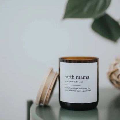 Candle labelled 'earth mama' with a wooden lid on a light surface. These Dictionary Meaning Candles are one of our most loved products. We have spent an abundance of time, curating our own meanings of the words to help you feel connected, to help you tell someone how you feel in a unique way. Available at LOVINLIFE Co Byron Bay