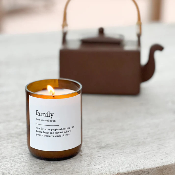 Candle labelled with the word "family"  on a stone surface, with a blurred teapot in the background. These Dictionary Meaning Candles are one of our most loved products. We have spent an abundance of time, curating our own meanings of the words to help you feel connected, to help you tell someone how you feel in a unique way. Available at LOVINLIFE Co Byron Bay