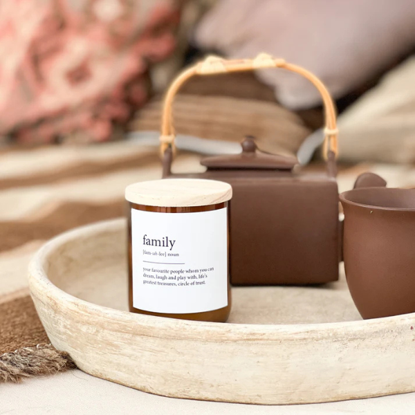 Candle labelled 'family' in a ceramic tray with a teapot in the background. These Dictionary Meaning Candles are one of our most loved products. We have spent an abundance of time, curating our own meanings of the words to help you feel connected, to help you tell someone how you feel in a unique way. Available at LOVINLIFE Co Byron Bay