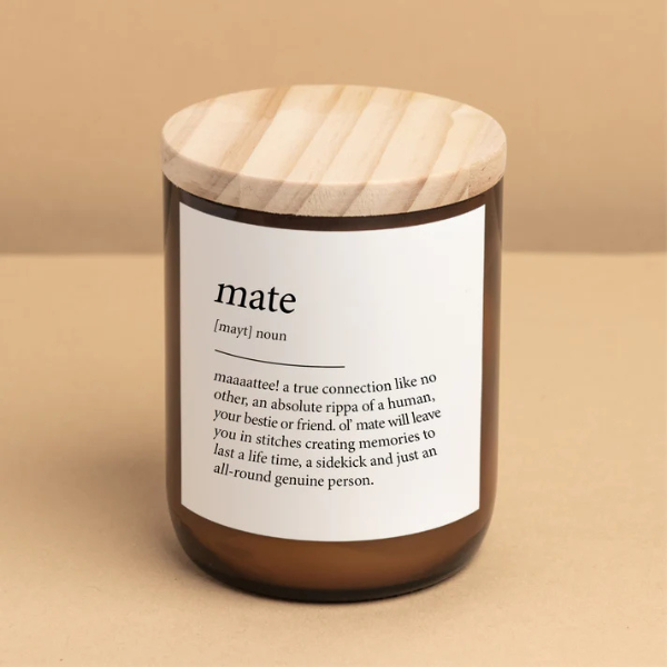 Candle labelled with the word "mate" with a wooden lid and label on a beige background. These Dictionary Meaning Candles are one of our most loved products. We have spent an abundance of time, curating our own meanings of the words to help you feel connected, to help you tell someone how you feel in a unique way. Available at LOVINLIFE Co Byron Bay