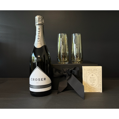 Celebrate Gift Box containing Croser Sparkling Wine, 2 stemless Champagne flutes in lustre bronze gilded and a twin box of Loco Love Chocolates. Available at LOVINLIFE Co Byron Bay