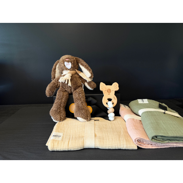 Deluxe Baby Gift Box containing Stuffed Soft Toy Rabbit, a Koala Teether made of Silicone and natural wood beads,  and Muslin Baby Wraps in sand, pink and olive pictured. Available at LOVINLIFE Co Byron Bay