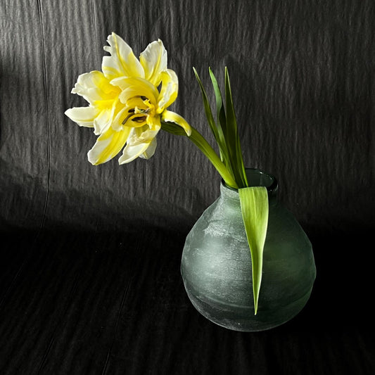 Eucalypt Bud Vase - green glass with a frosted exterior - gentle lines circling the droplet-like shaped vase - pictured with flowers - available at LOVINLIFE Co Byron Bay for all your gifts, candles and interior decorating needs