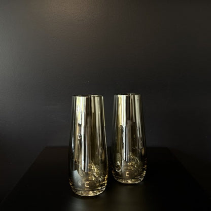 Pair of Francalia Piana Stemless Champagne Glasses gilded in Lustre Bronze, on a black background - Stocked at LOVINLIFE Co Byron Bay for all your gifts, candles, homewares and interior decorating needs
