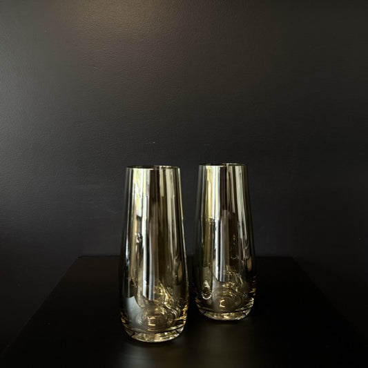 Pair of Francalia Piana Stemless Champagne Glasses gilded in Lustre Bronze, on a black background - Stocked at LOVINLIFE Co Byron Bay for all your gifts, candles, homewares and interior decorating needs