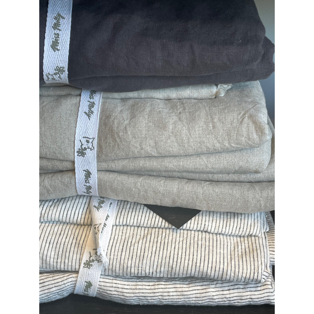 French flax linen sheets, prewashed and softened to sit gently against your skin – A selection of Charcoal, Grey and Pinstripe French linen bed sheet pictured - available at LOVINLIFE Co Byron Bay for all your gifts, candles and interior decorating needs